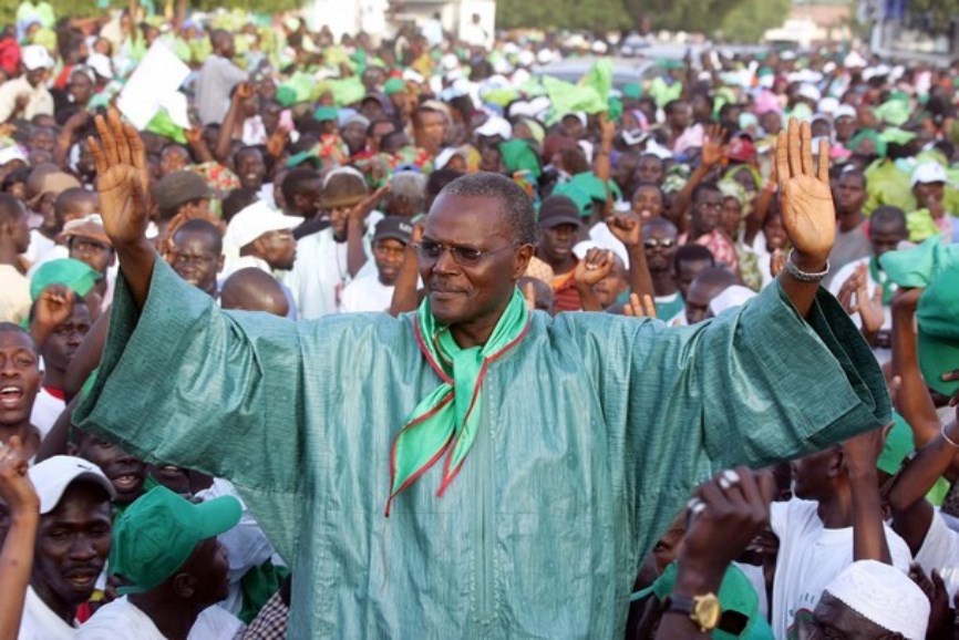 Ousmane Tanor Dieng, First Secretary of the Senegalese Socialist party and candidate to Presidential election greets supporters upon arriving for his first campaign meeting in Louga, 04 February 2007. Campaigning for the presidential election in Senegal began 04 February with the 80-year-old incumbent looking for another five-year term in charge of one of Africa's most stable democracies. President Abdoulaye Wade launched his reelection bid in front of an audience of tens of thousands with a pledge to act as a unifying force in his country. His Socialist Party challenger Ousmane Tanor Dieng attacked Wade over the problems of agriculture and agreements on immigration with France and Spain aimed at stemming illegal immigration.             AFP PHOTO / GEORGES GOBET (Photo credit should read GEORGES GOBET/AFP/Getty Images)
